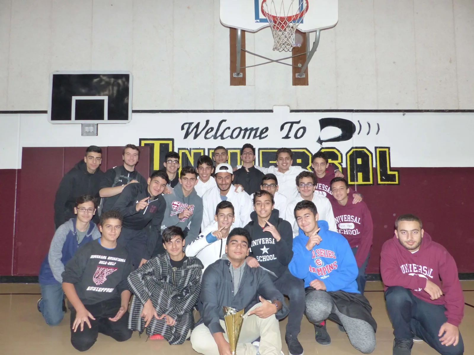 Universal School students gathered in the gym beneath the Welcome banner on a game night