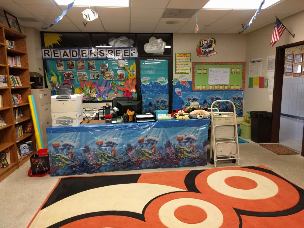 Children reading together in the school's Readers Reef reading corner
